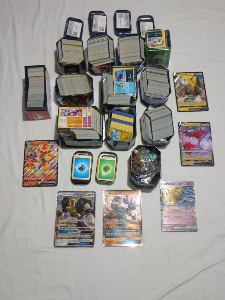 Large Collection of Pokémon Cards, Tins, and Accessories