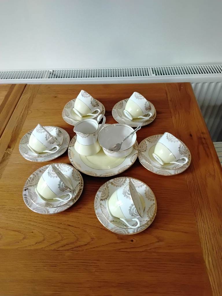 Vintage Tea Set with Cups, Saucers, Milk Jug, and Sugar Bowl