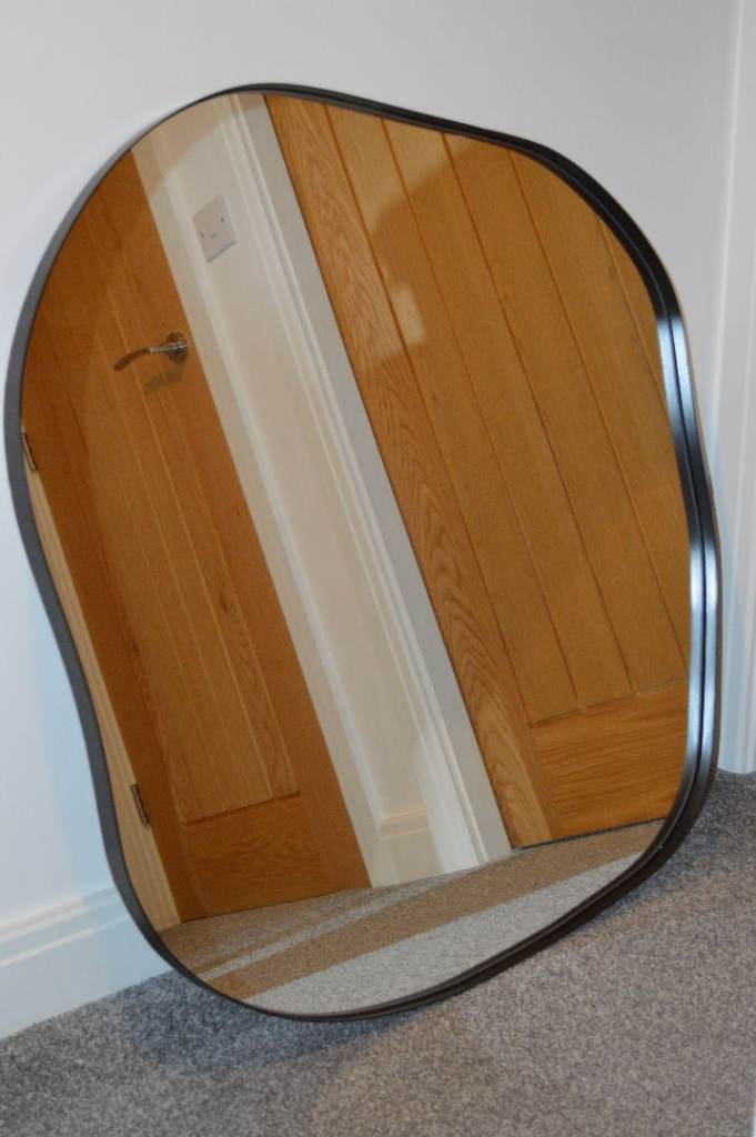 FOR SALE – NEW BLACK METAL PEBBLE SHAPE WALL MIRROR