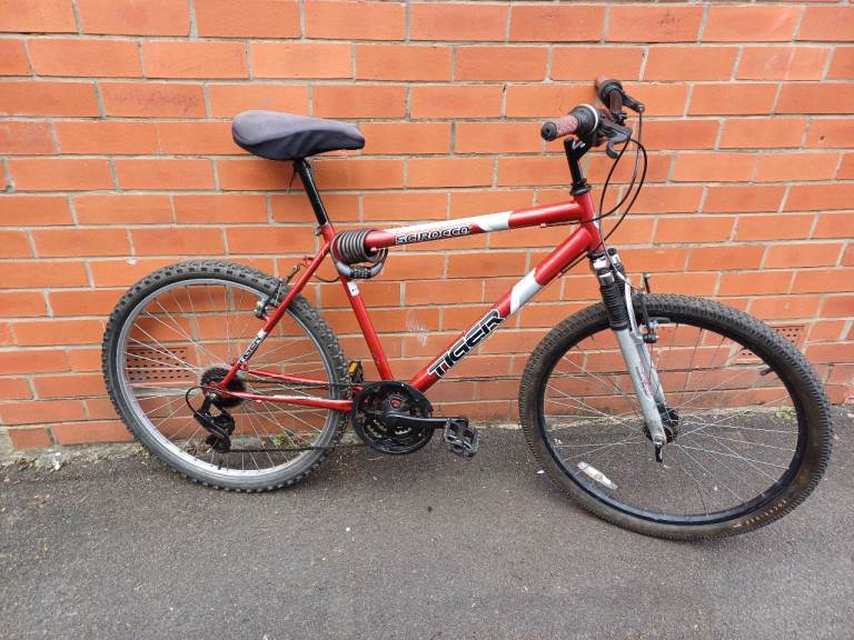 Tiger Mountain , City Bike - front suspension , comfortable seat and gell cover , good brakes .