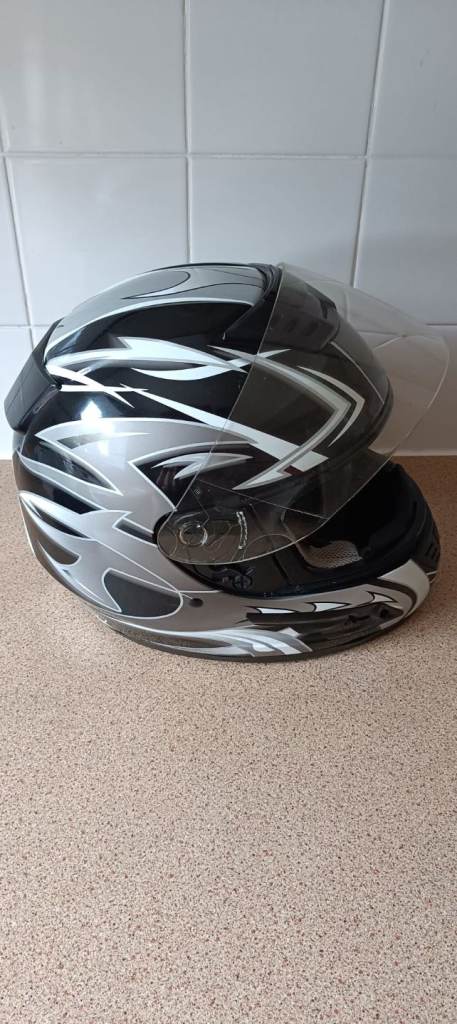 Medium grey/black/white motorbike helmet