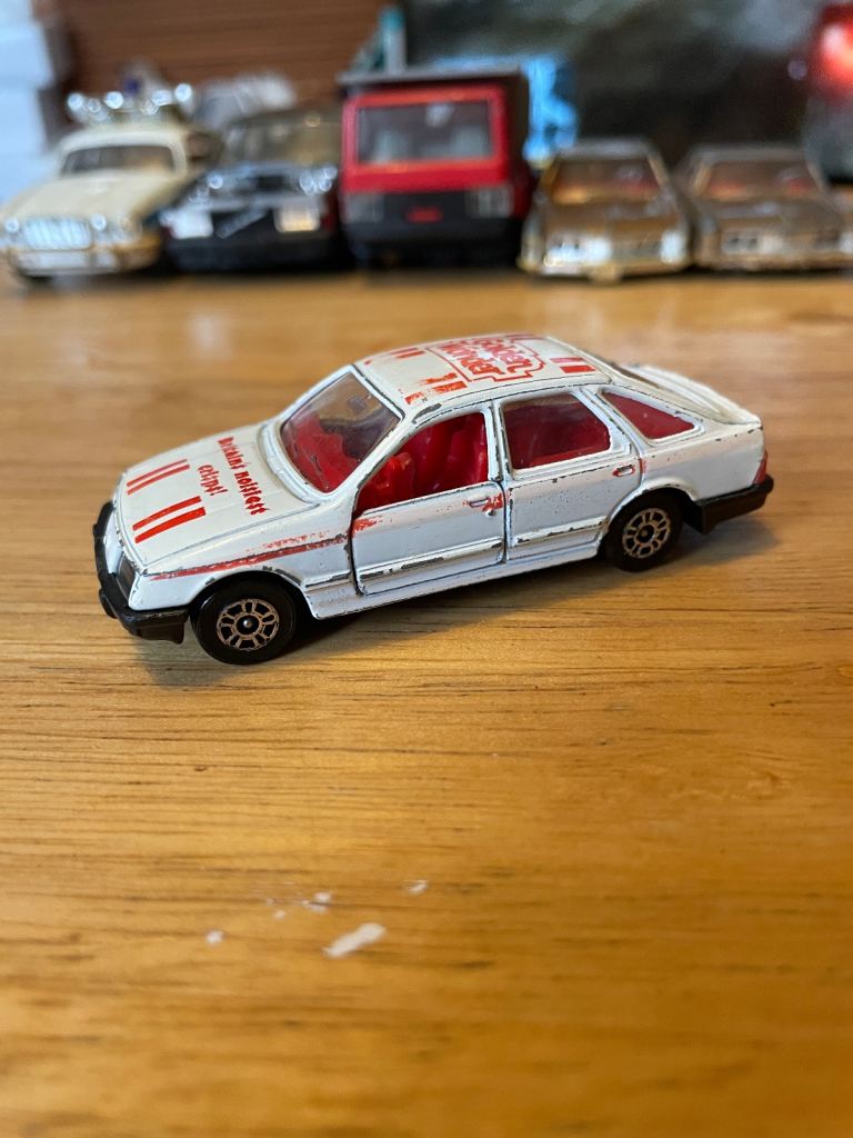 Vintage Corgi Juniors Ford Sierra 2.3 Ghia, featuring “Golden wonder” livery 