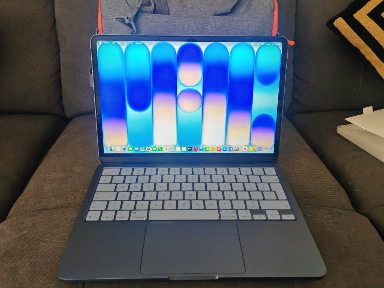 MacBook Neo with case and charger 