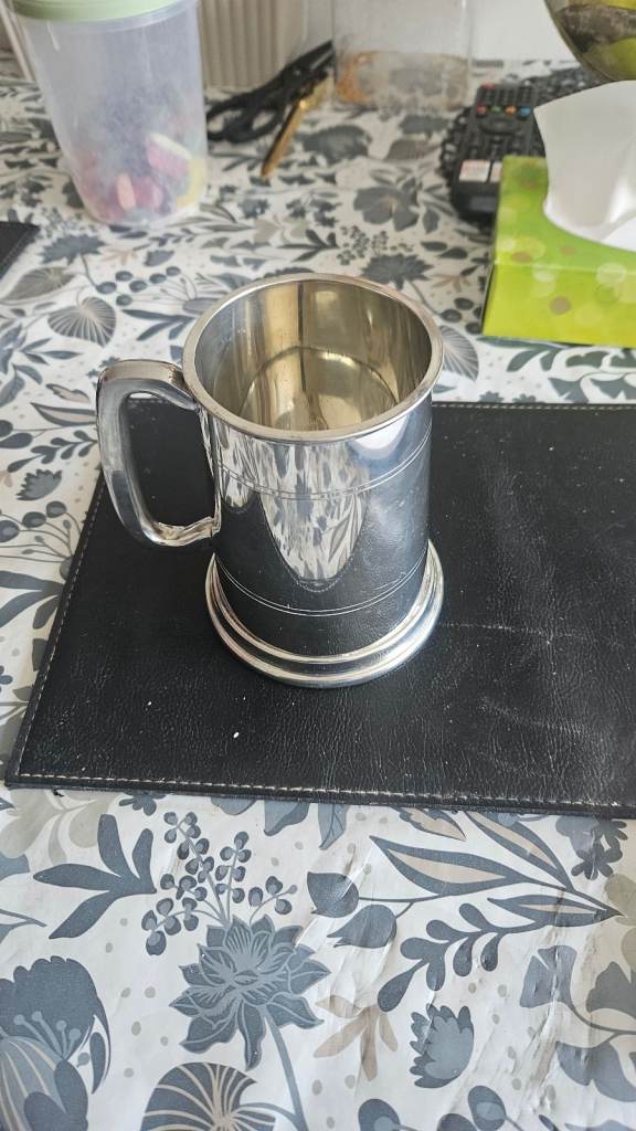 Traditional English pewter tankard likely to be a pint capacity 