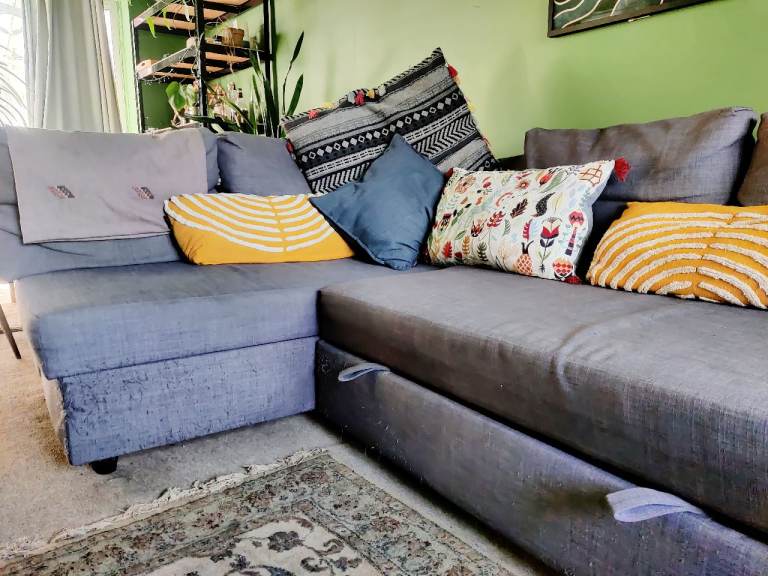 Dark grey IKEA Frieheten corner sofa with storage 
