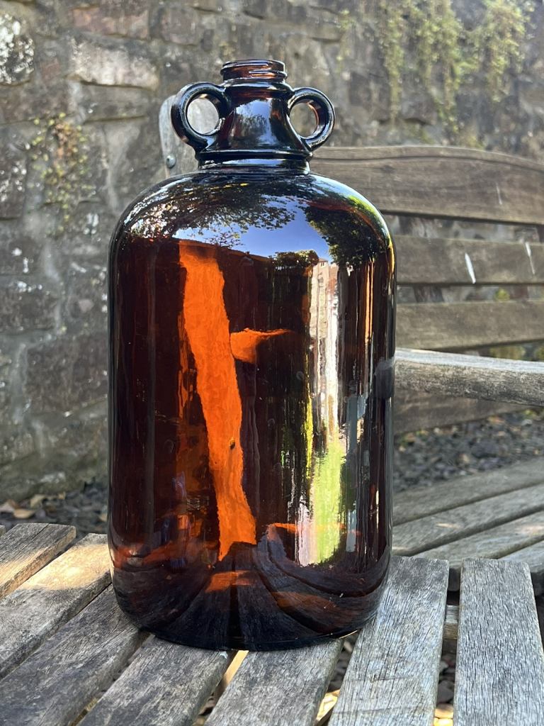 LARGE BROWN GLASS DEMI JOHN JUG VADE WOULD MAKE IDEAL LAMP BASE  