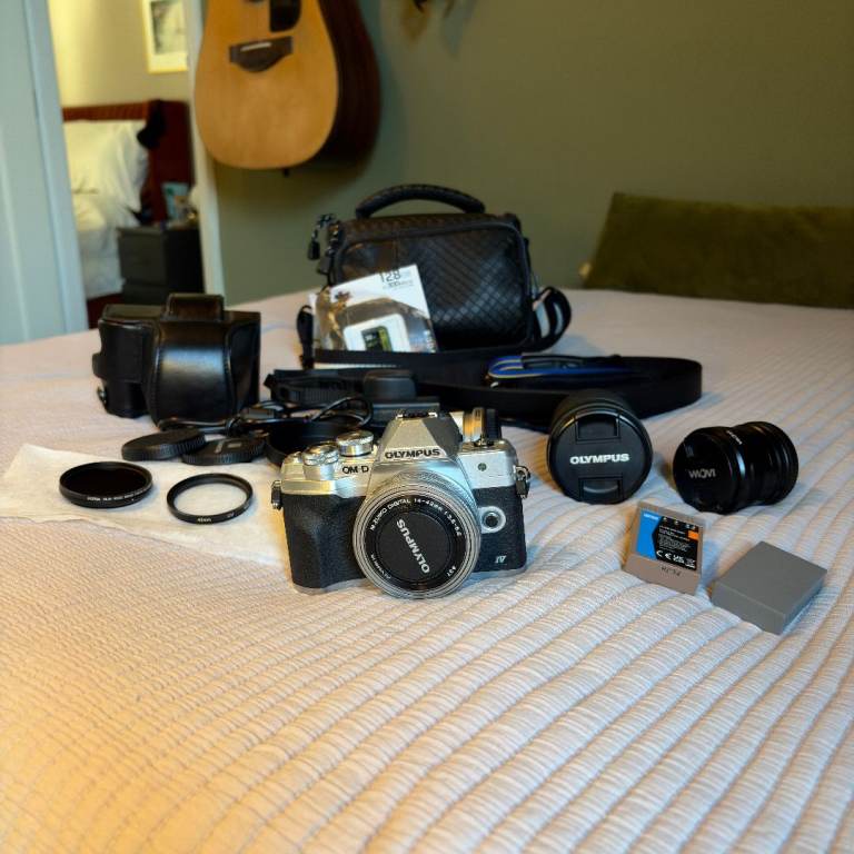 Olympus OM-D E-M10 Mark IV Silver + Premium Micro Four Thirds Lens Bundle + Accessories