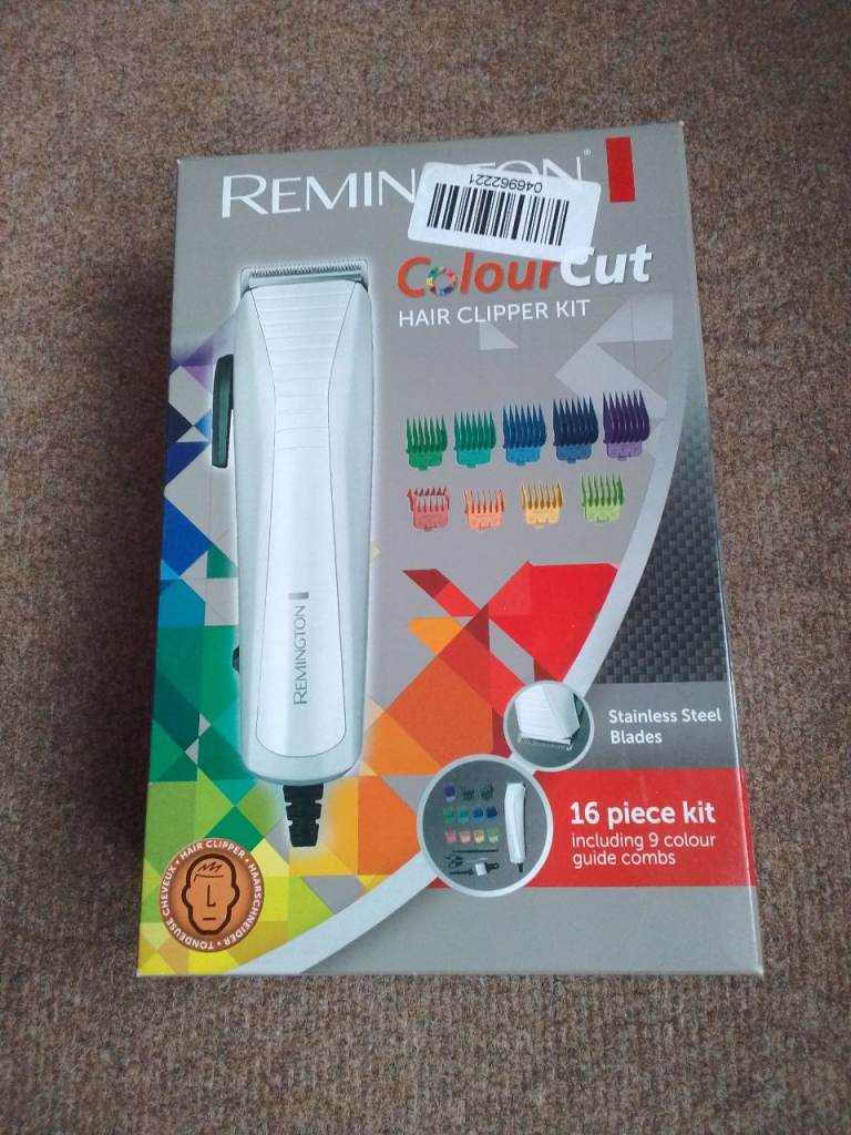Remington Hair clippers set corded new and boxed, 16 piece kit including 9 colour guide combs .