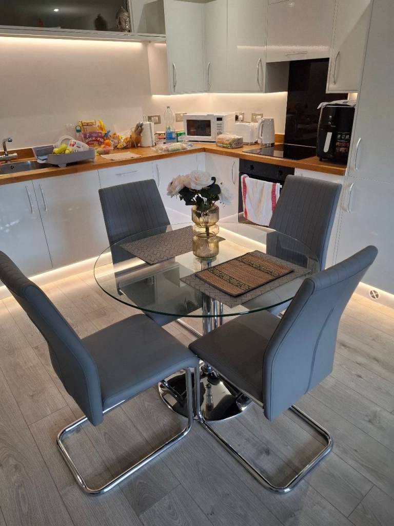 Round glass dining table and 4 x chairs