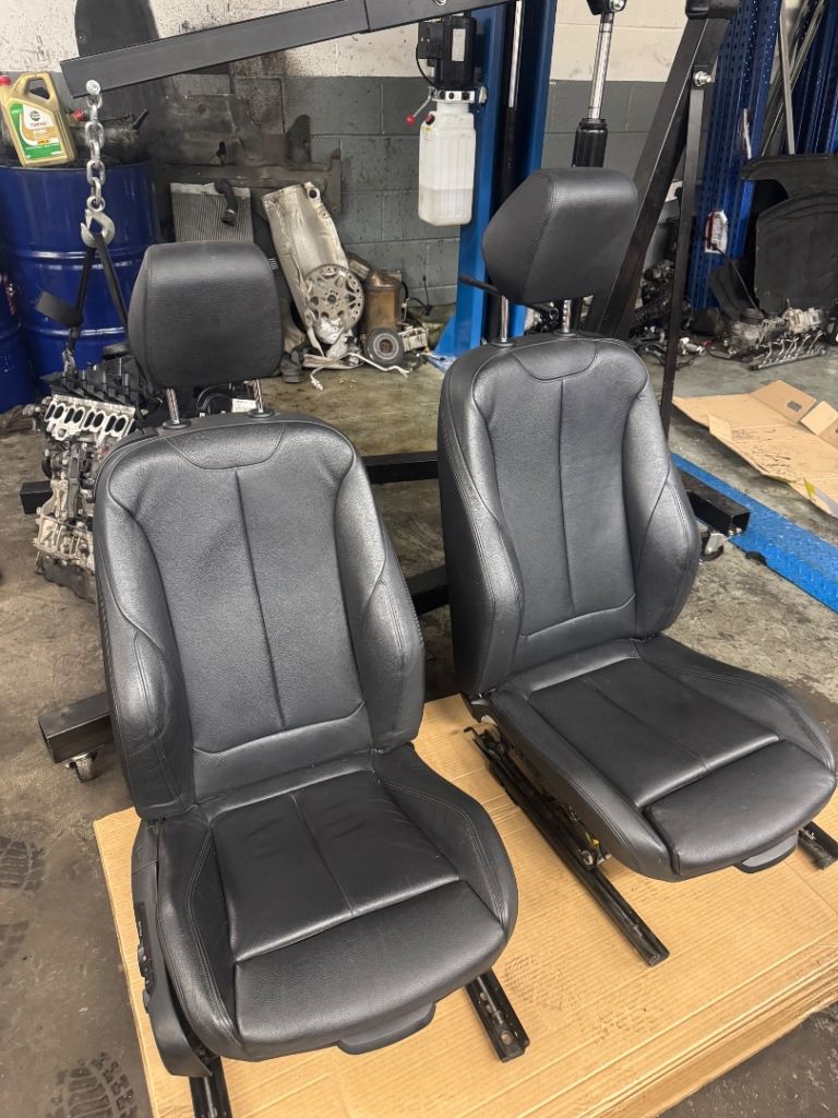 Set of black front seat from a bmw e93 brand new 