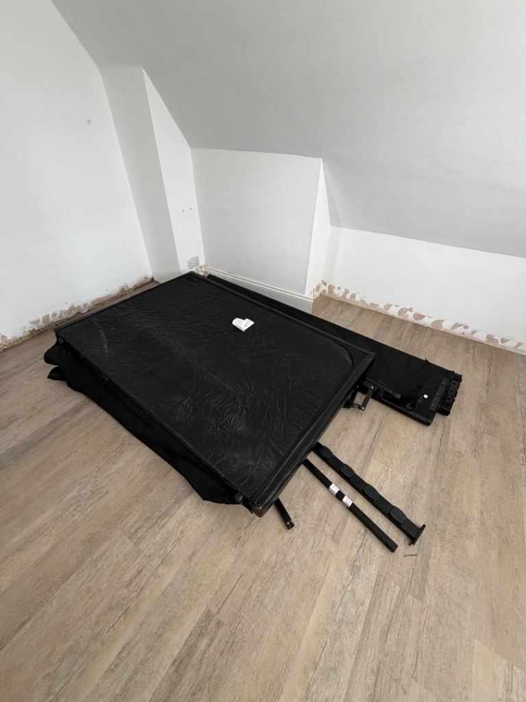 Black ottoman bed frame with slats