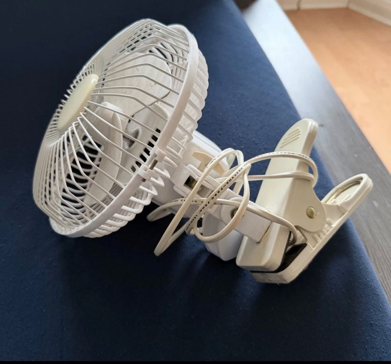 Small standard sized,plug-in,clip-fan with high-low,dial setting.