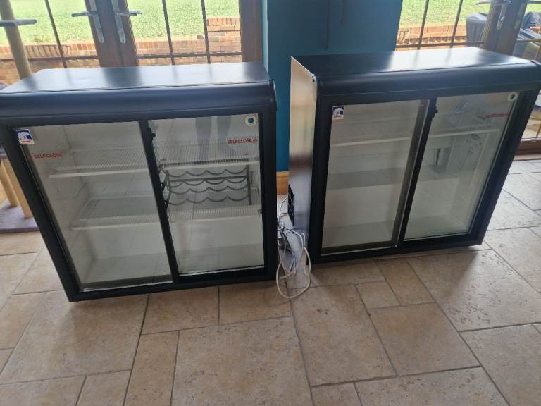 Two coke cola fridges 