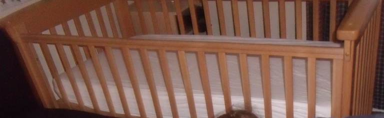 Convertible cot / toddler bed + mattress + bedding