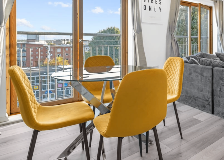 Modern Glass Dining Table with 4 Yellow Chairs – As Good As New
