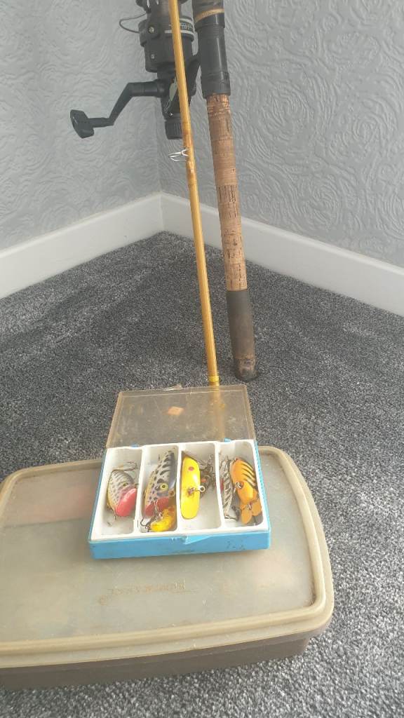 Eight and half foot spinning rod with reel and various tackle and tupperware box.