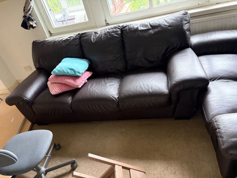  comfy brown leather sofa, 3+2 seater and comes with a matching footstool.  free,