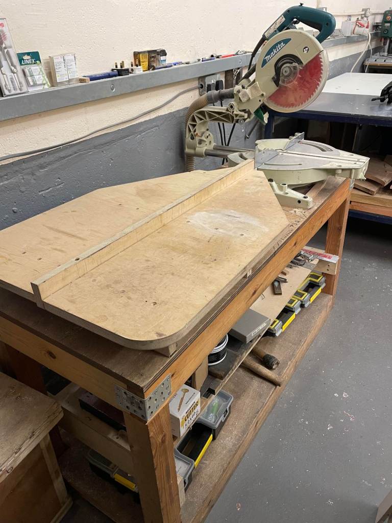 Makita sliding chop saw used with bench.