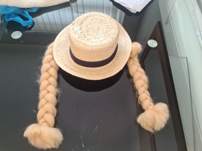 Novelty straw hat with pony tails braided hair. Stag or hen doo