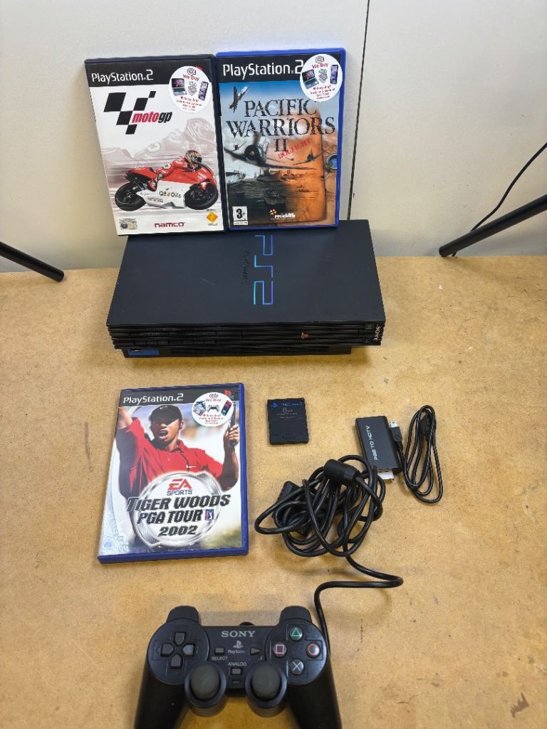 Ps2 console with games and controller 