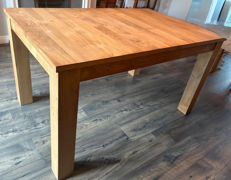 Extending teak dining table