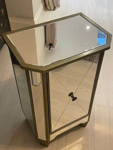 Mirrored glass cabinet with champagne gold finish