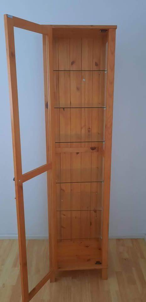 Wooden cabinet with glass shelves