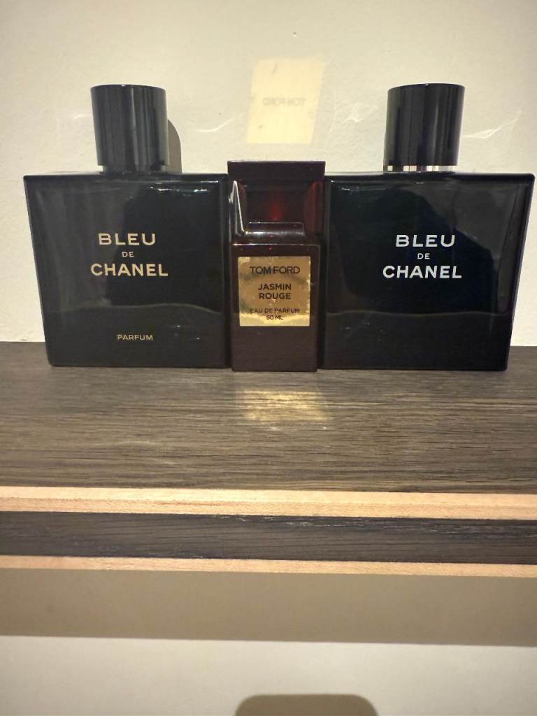 Bleu De Chanel and Tom Ford Jasmine Rouge empty perfume bottles