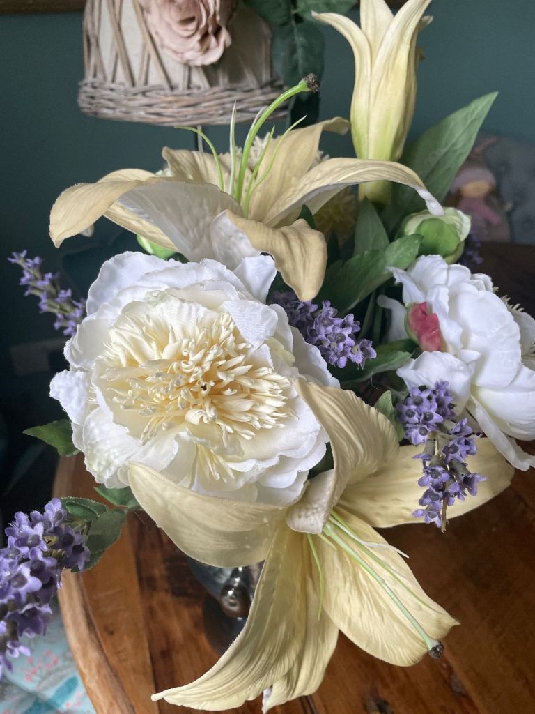 Lovely navy vase/urn shape with silk flower arrangement 