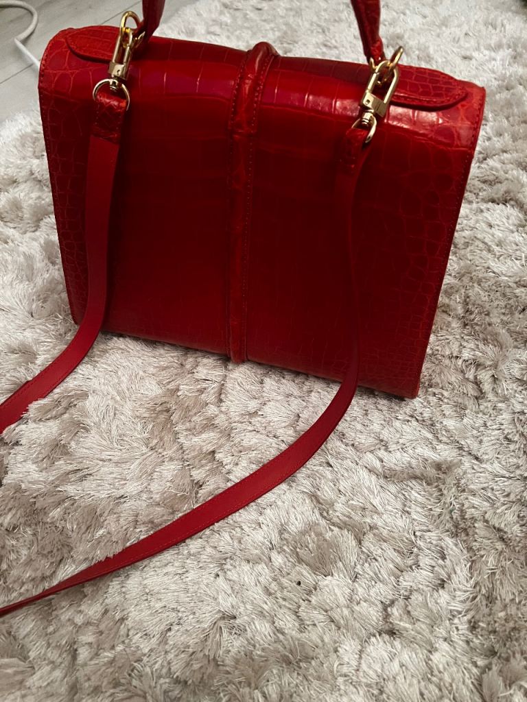 Red alligator leather handbag