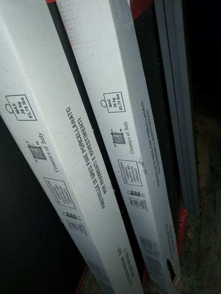 Quartz countertop and new black floor tiles