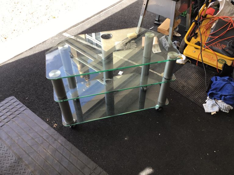 Glass TV Stand with 3 Shelves and Wheels – Good Condition