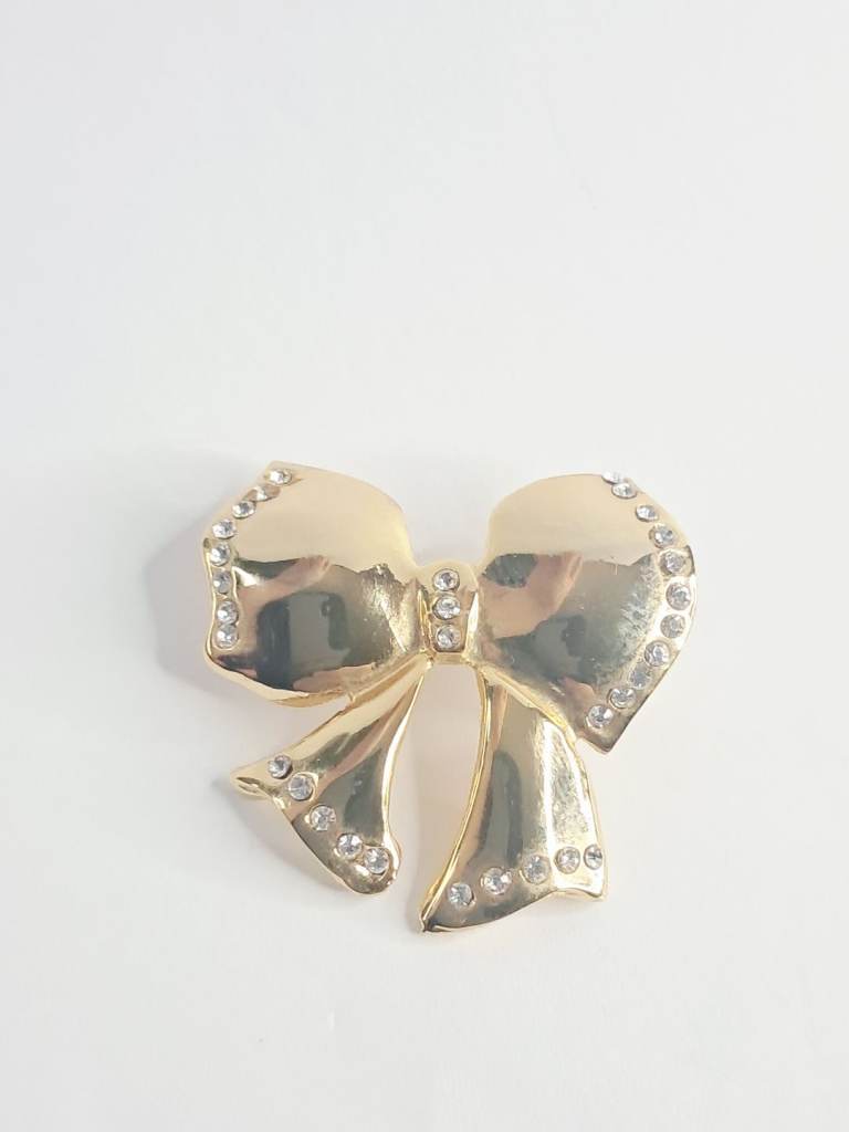 vintage Woman's  gold-toned bow brooch with rhinestones.
