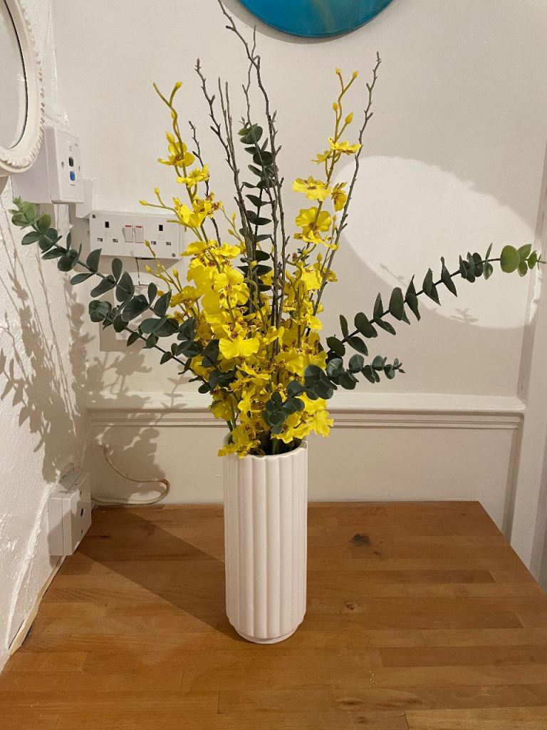Yellow Artificial Orchid and Twig Arrangement in a Ceramic Vase