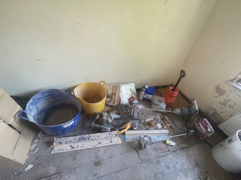 Plastering and damp proofing tools and materials. 
