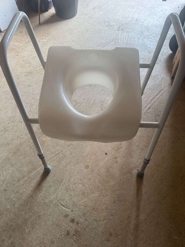 Mobility disability raised toilet seat frame 