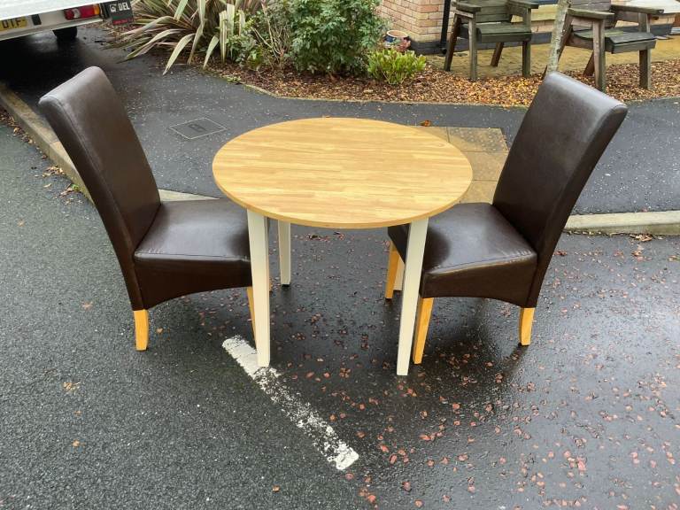 Small to round dining room table and 2 leather chair only £69