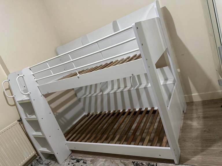 2 bunk beds, with integral ladder and shelves, strong build, excellent condition