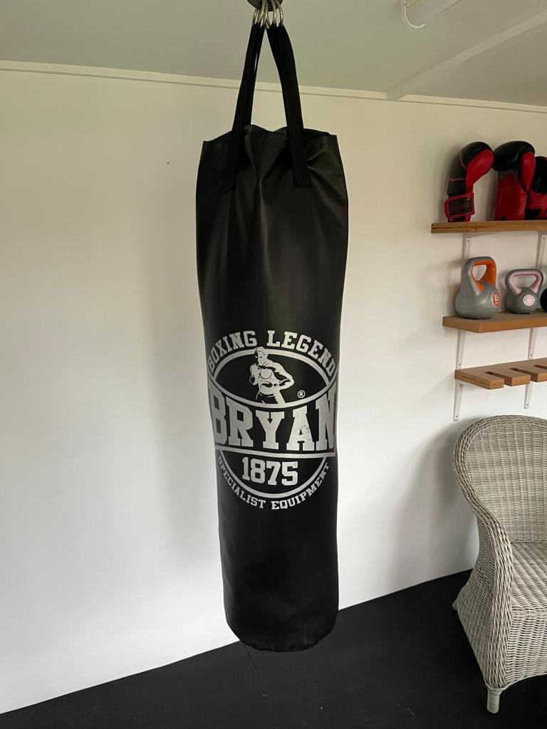 Boxing punch bag with male and female gloves and pads