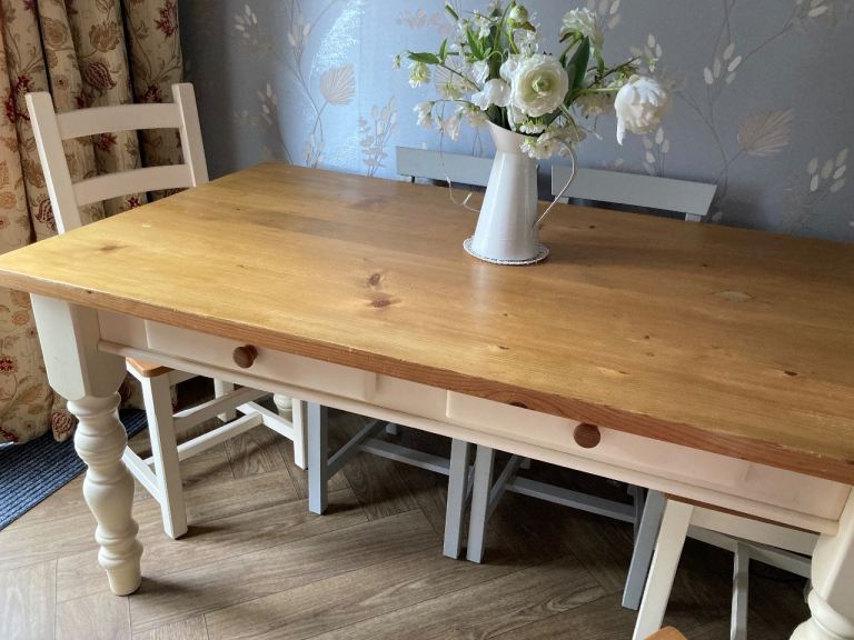  solid table with drawers and four chairs , cream legs /base -edging  