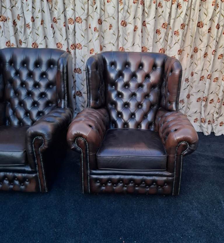 image for 2 brown Chesterfield armchairs