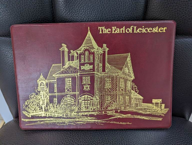 THE EARL OF LEICESTER PUB NORWICH BURGUNDY & GOLD PLACEMAT LATE 20TH CENTURY