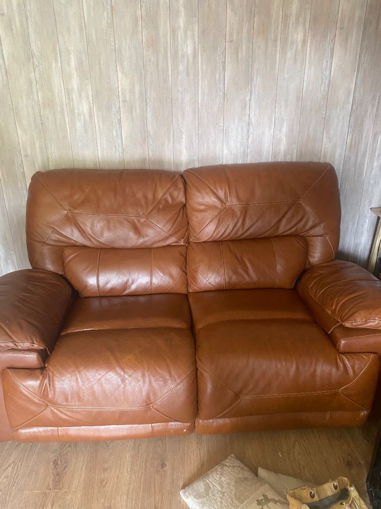 Brown faux leather sofa
