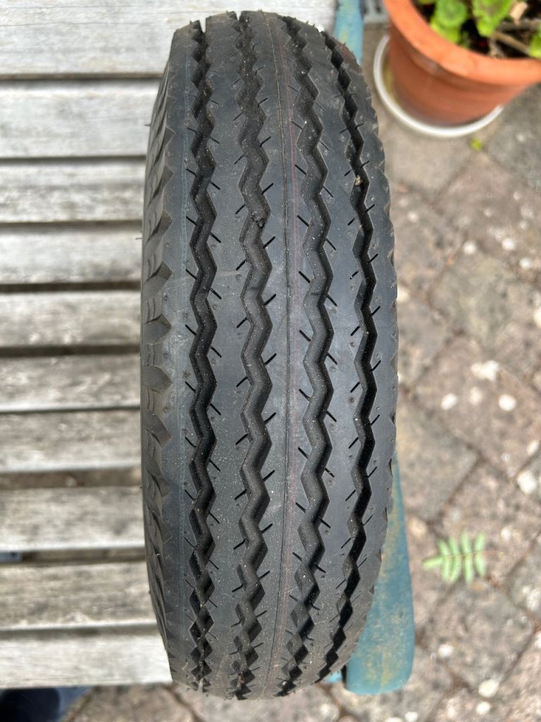 Unused spare trailer wheel