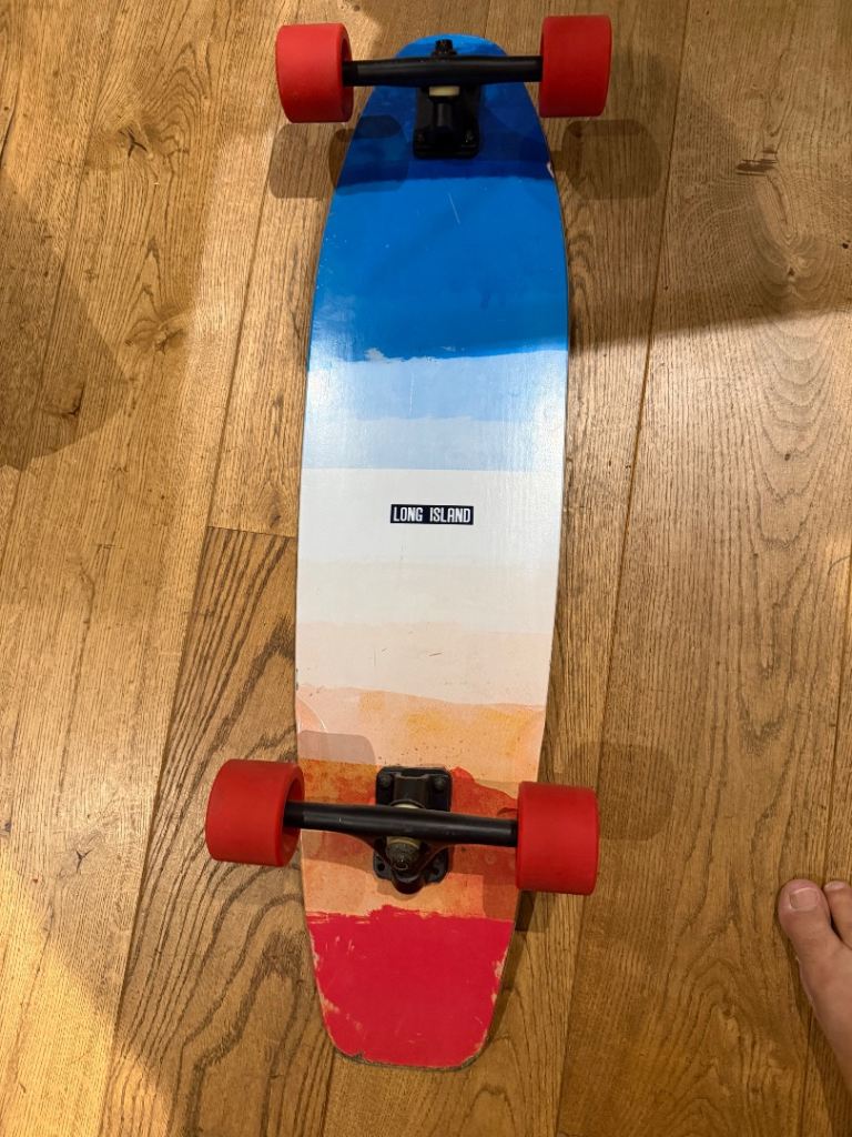 Long Island Cruiser Skateboard - Multicoloured Deck with Red Wheels