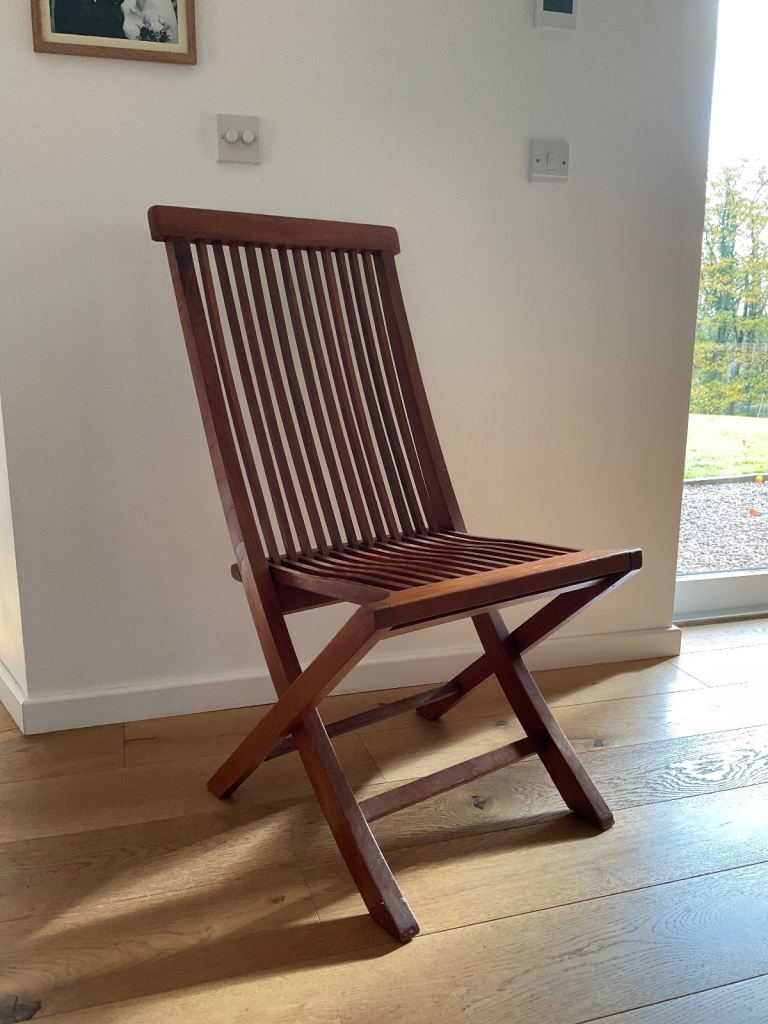 Polished Balinese folding teak chair
