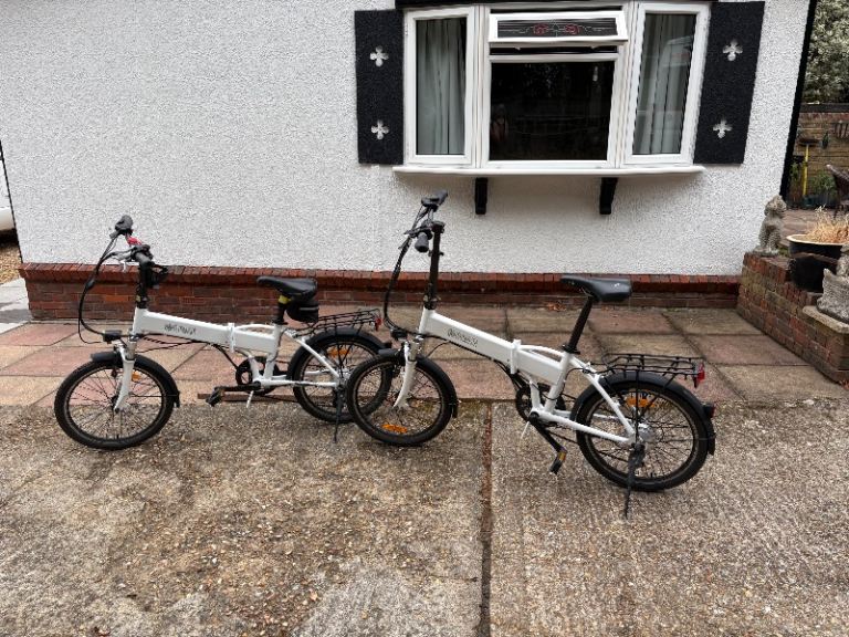 Pair of White Electric Folding Bikes – Great for Commuting