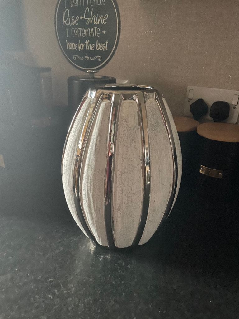 image for 2x silver and white vases purchased in Skye