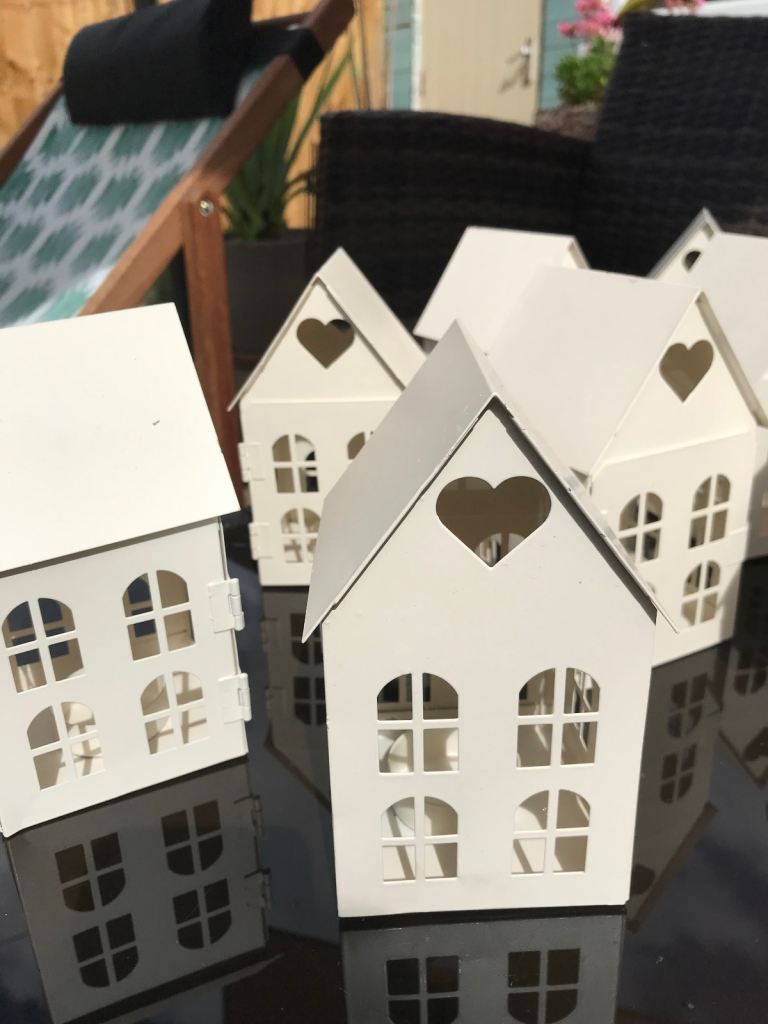 Decorative tea light holders, houses. 