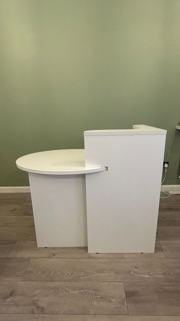 Small white reception desk